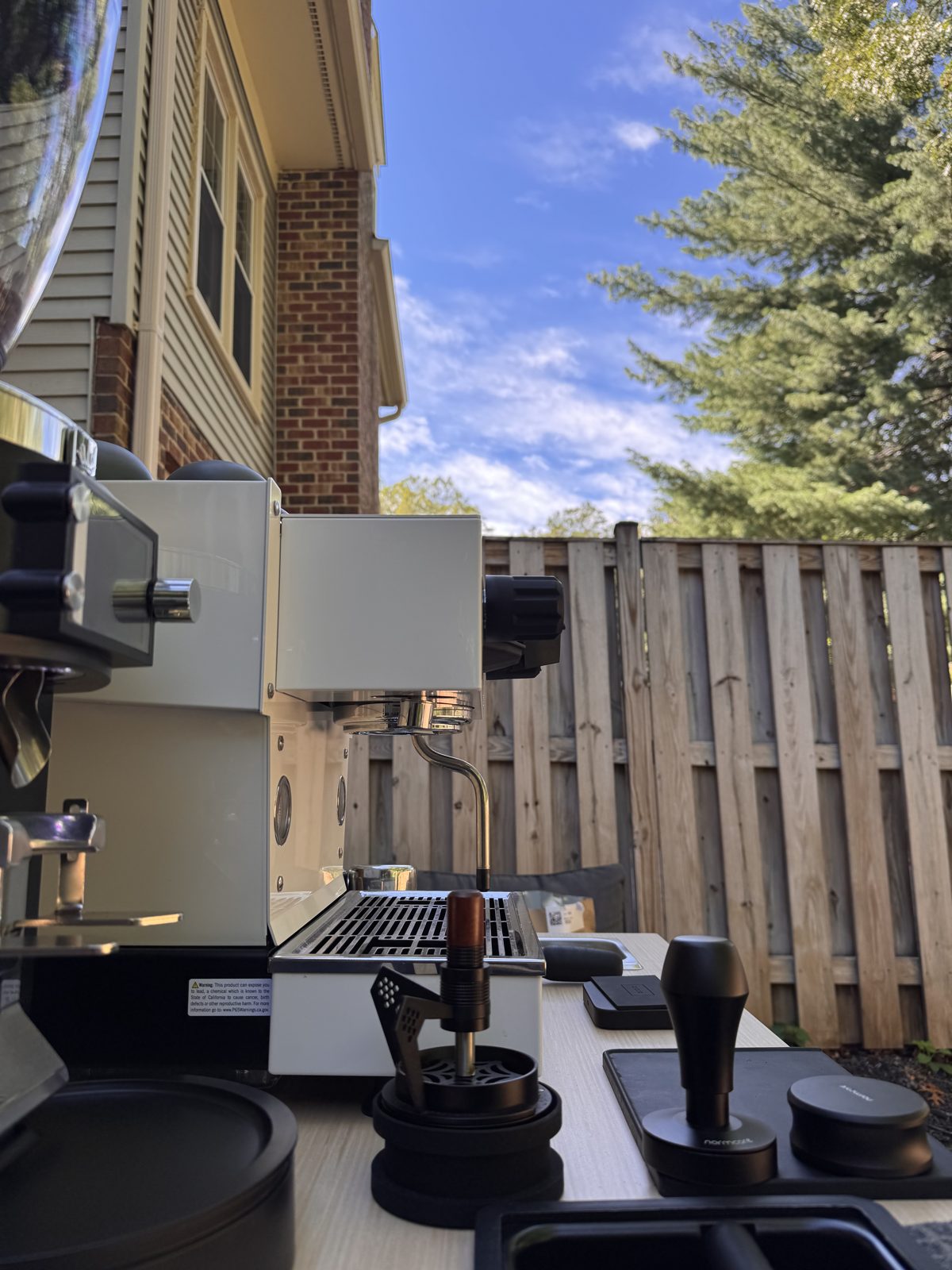 Drop Shot barista at the La Marzocco espresso cart during a private backyard event in the DMV